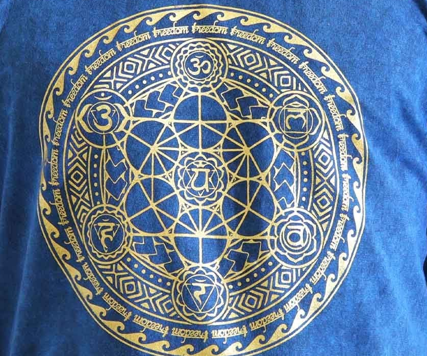 Lifestyle image of the Chakra Large Stone Washed T-Shirt in Blue as a cozy gift idea for Christmas or pamper nights.