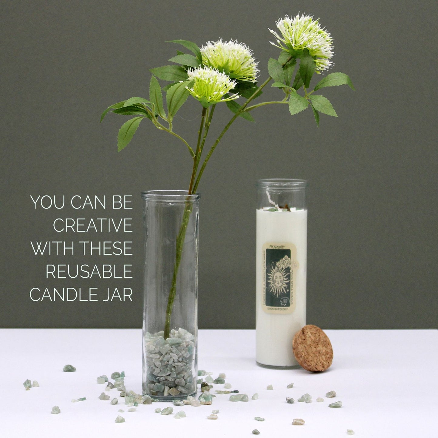 Reusable candle jars displayed with flowers and decorative stones, featuring the Green Aventurine & Moroccan Rose Soy Candle. A charming addition to your decor and a thoughtful Christmas gift for home fragrance enthusiasts.