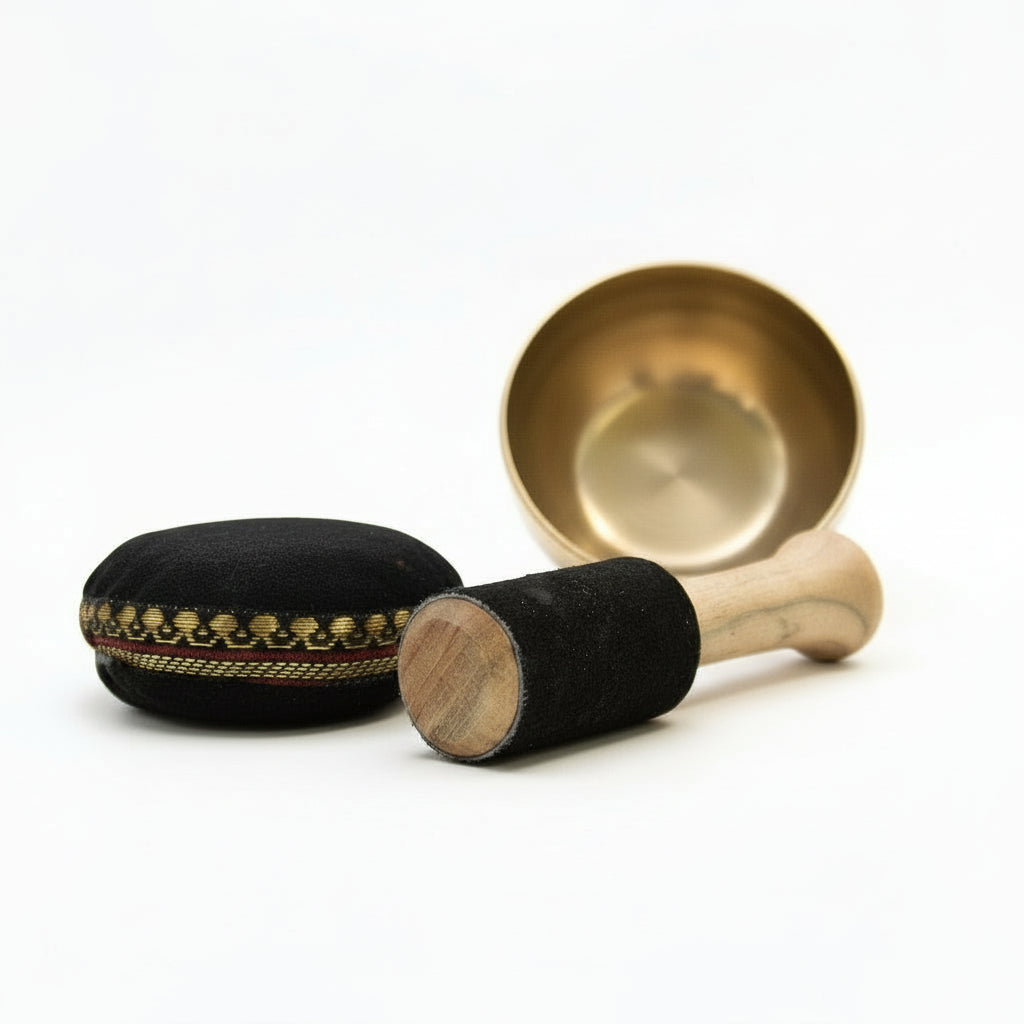 Close-up of the Brass Singing Bowl Set - 9cm Tibetan Gift for Inner Calm highlighting the beautifully crafted bowl and suede stick, ideal for creating soothing sounds during relaxation. This {{scent}} {{product_type}} – Christmas Gift Home Fragrance enhances your wellness routine.