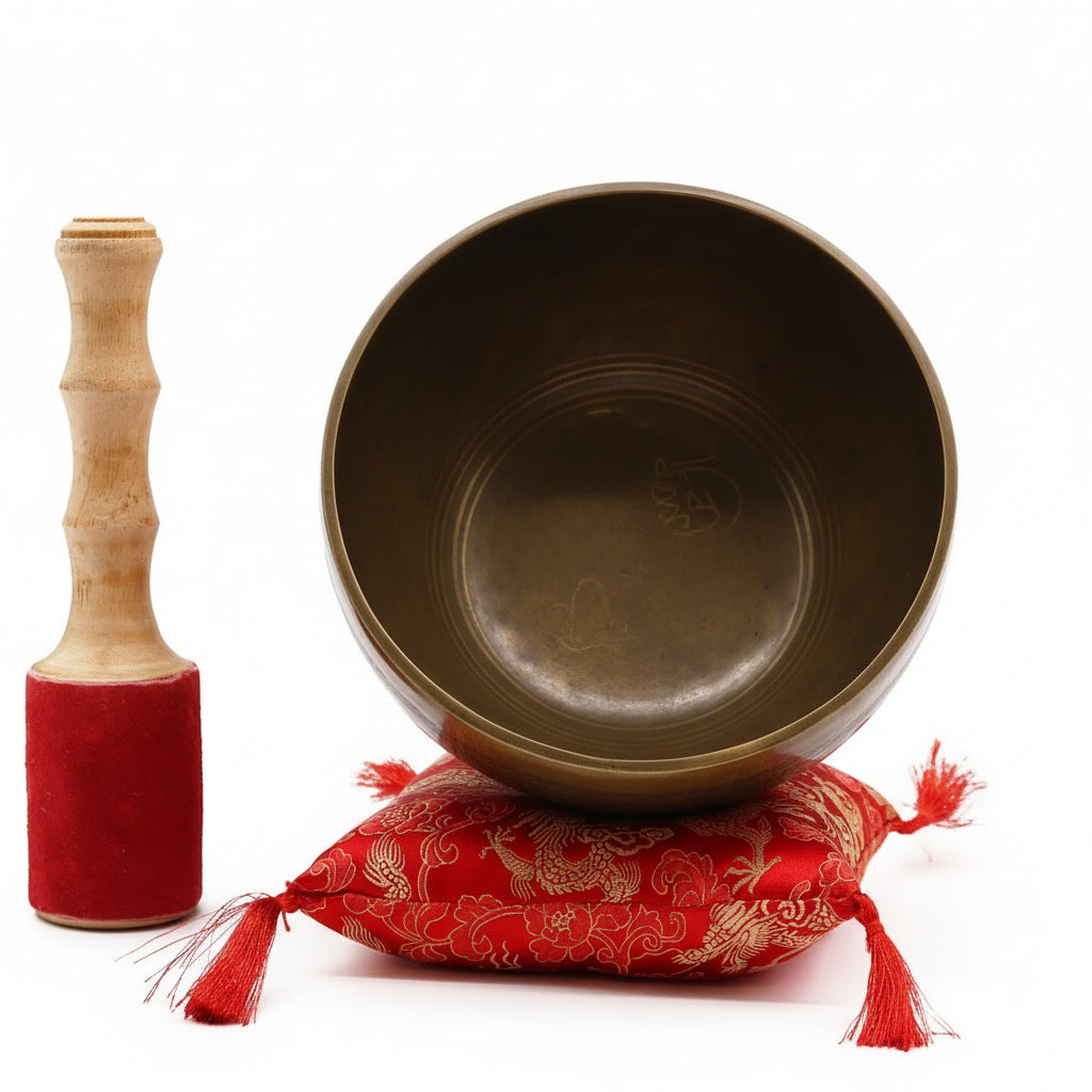 Brass Golden Tara Singing Bowl Gift Set - Tibetan Serenity displayed with a vibrant red cushion and suede-coated stick, perfect for meditation and relaxation. This {{scent}} {{product_type}} – Christmas Gift Home Fragrance adds tranquility to any space.