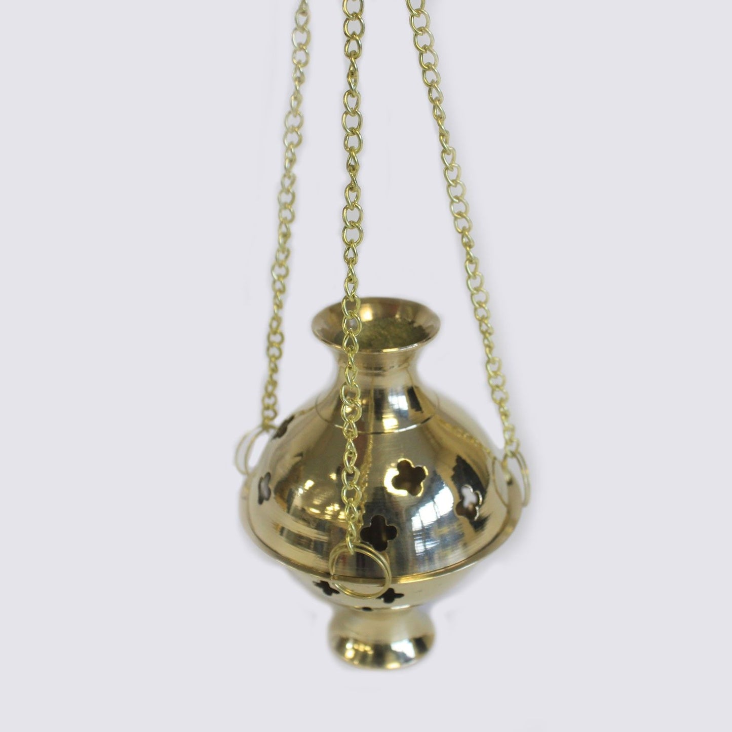 Close-up view of the Hanging Brass Incense Burner, showcasing its elegant design and intricate cut-outs. Perfect for meditation and rituals, this burner adds a touch of sophistication to any setting and serves as a lovely Christmas gift. Elevate your space with this exquisite scent product – Christmas Gift Home Fragrance.