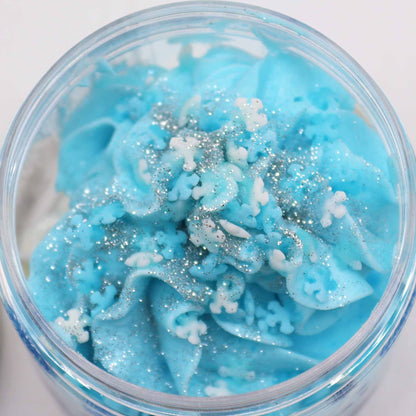 Close-up of White Christmas Whipped Soap 120g revealing the vibrant blue and white swirls with glitter accents, capturing the essence of festive cheer – Christmas Gift Home Fragrance.
