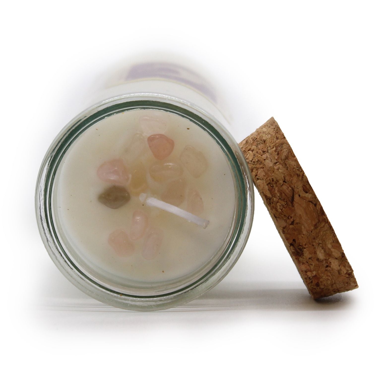 Top view of the Love Spell Candle with Rose Quartz & Jasmine, showcasing the heart-shaped gemstones and wooden cork lid. This enchanting soy wax candle is a perfect Christmas gift home fragrance.