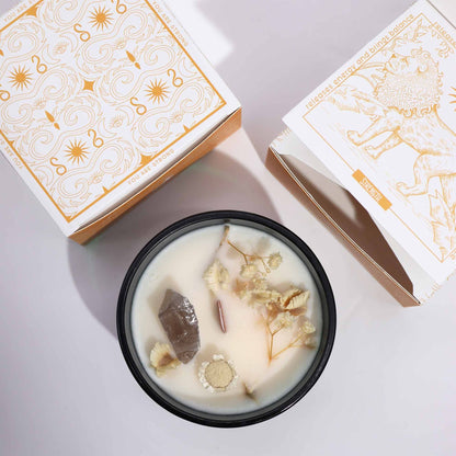 Close-up of the Hop Hare Magical Flower Candle with Tarot Card - Jasmine Garden Scent in a black container, highlighting the decorative flowers and rock quartz. Ideal for a Christmas gift home fragrance.