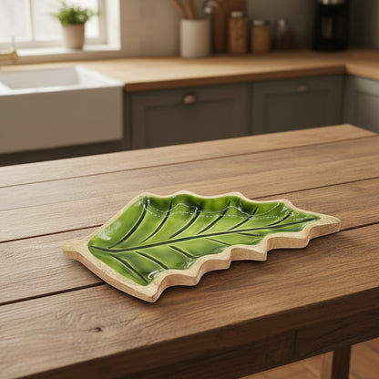 Elegant Leaf-Shaped Wooden Bowl - Sustainably Crafted 33x17cm showcasing a glossy green enamel interior and unique mango wood grain, perfect for functional decor and a stylish centrepiece. Ideal as a {{scent}} {{product_type}} – Christmas Gift Home Fragrance.