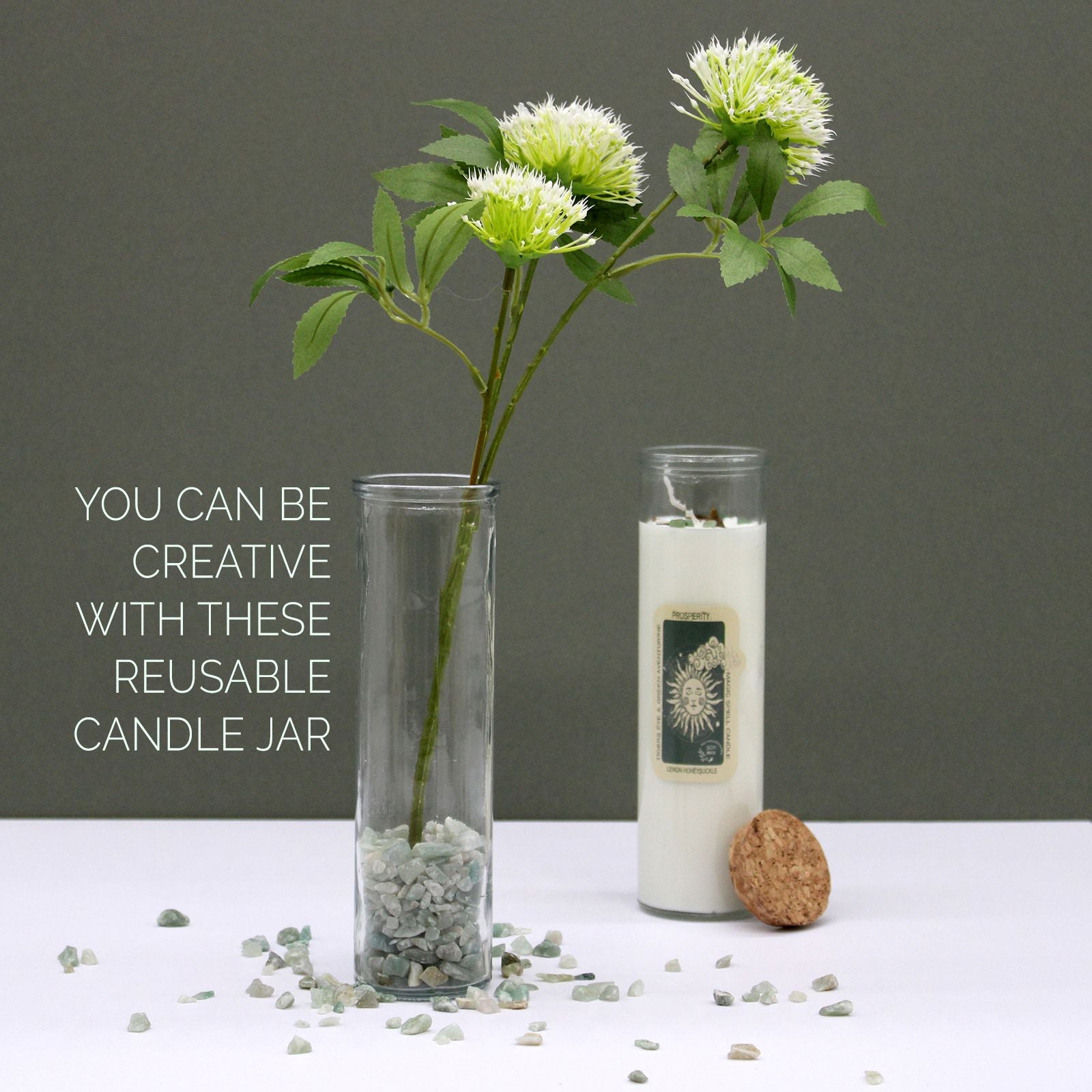 Reusable candle jars displayed with flowers and decorative stones, featuring the Green Aventurine & Moroccan Rose Soy Candle. A charming addition to your decor and a thoughtful Christmas gift for home fragrance enthusiasts.