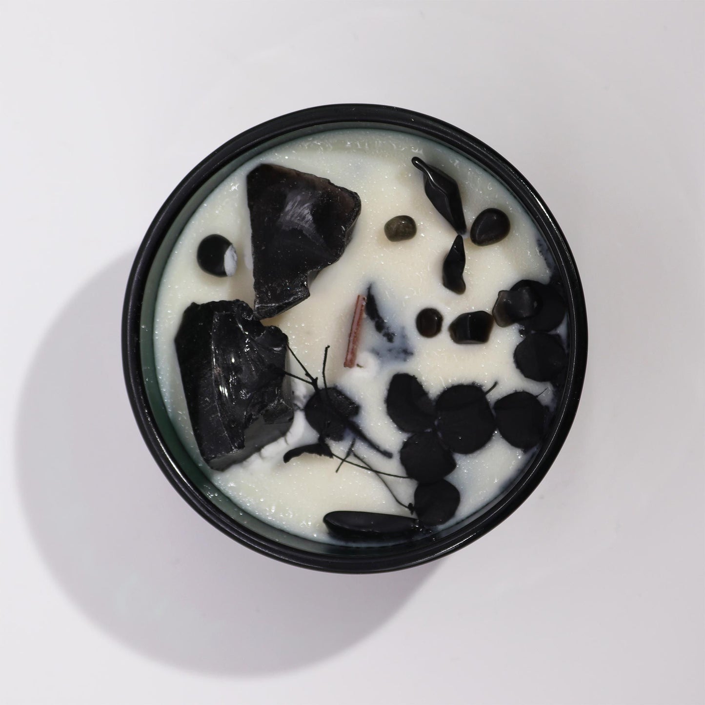 Top view of the Hop Hare Crystal Flower Candle - Knight of Swords Magic & Cedarwood, featuring a blend of black obsidian and floral decor. A delightful Christmas Gift Home Fragrance.