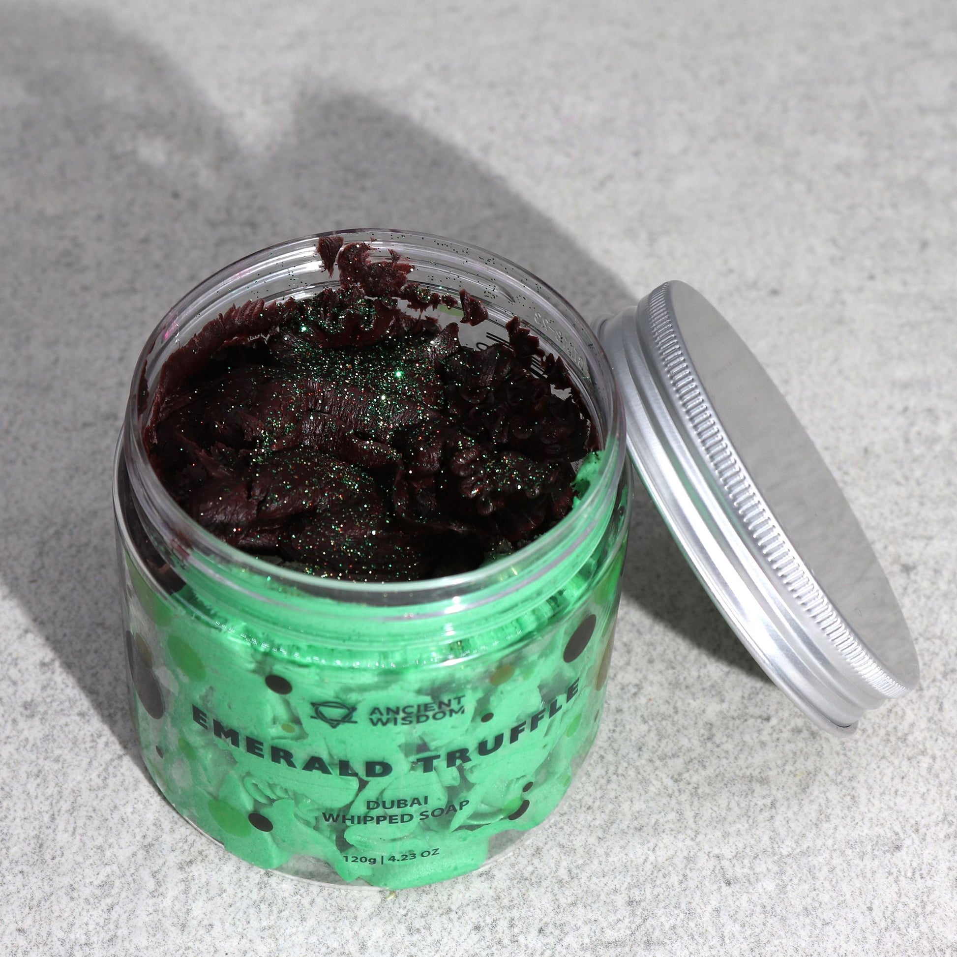Close-up view of the Emerald Truffle Whipped Cream Soap in a jar, showcasing its luxurious whipped texture and subtle glitter. This indulgent soap makes for a perfect Christmas gift home fragrance.