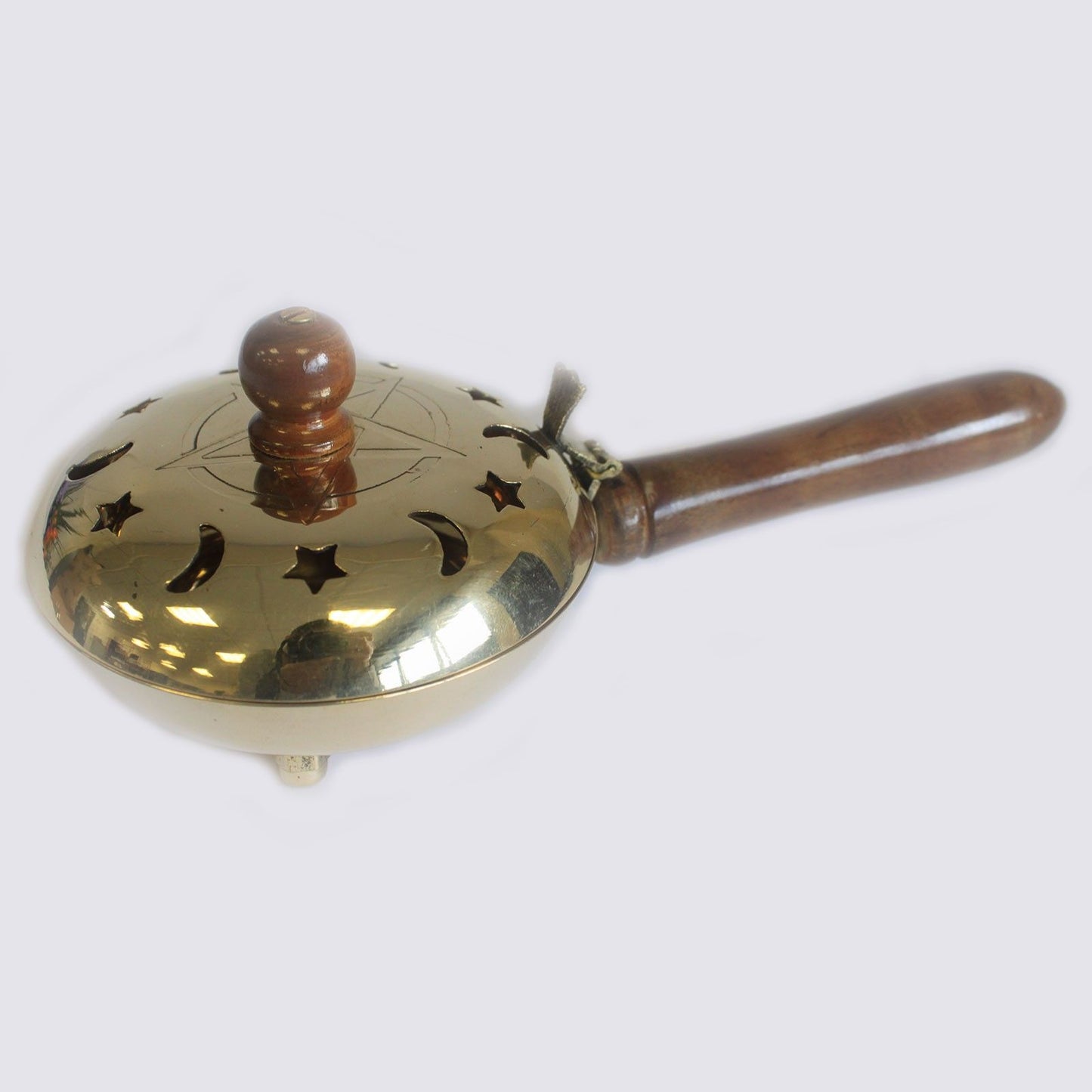 Close-up of Brass Pentagram Incense Butler with Wooden Handle, showcasing the elegant brass finish and intricate cut-outs for smoke flow. A stylish accessory for meditation or as décor – Christmas Gift Home Fragrance
