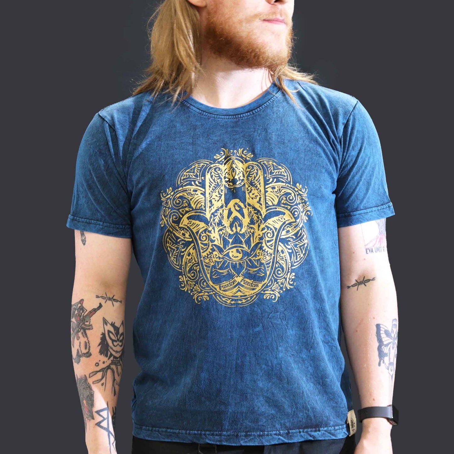Model wearing the Hamsa Blue Large Stone Washed T-Shirt, featuring a striking Hamsa symbol design, combining style and spiritual vibes. A great choice for a Christmas gift that adds flair to any wardrobe.