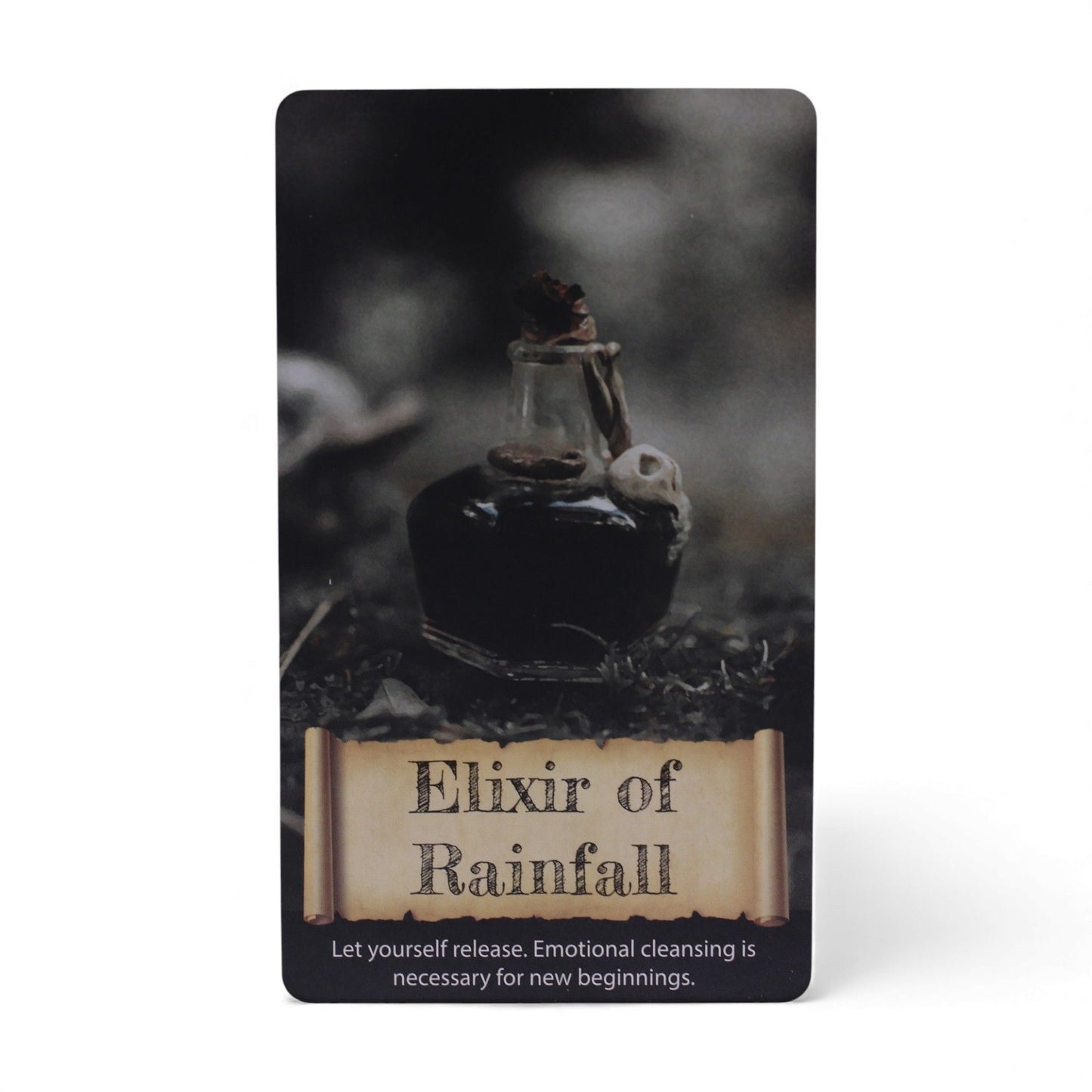 Elixir of Rainfall card from the Crystals & Elixirs Oracle Cards deck, featuring a potion bottle, representing emotional cleansing and new beginnings. Perfect {{scent}} {{product_type}} – Christmas Gift Home Fragrance.