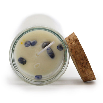 Top view of Sodalite & Dragon's Blood Candle showcasing Sodalite gemstones inside. This candle enhances any space with its exquisite scent, making it an excellent Christmas gift for home fragrance lovers.