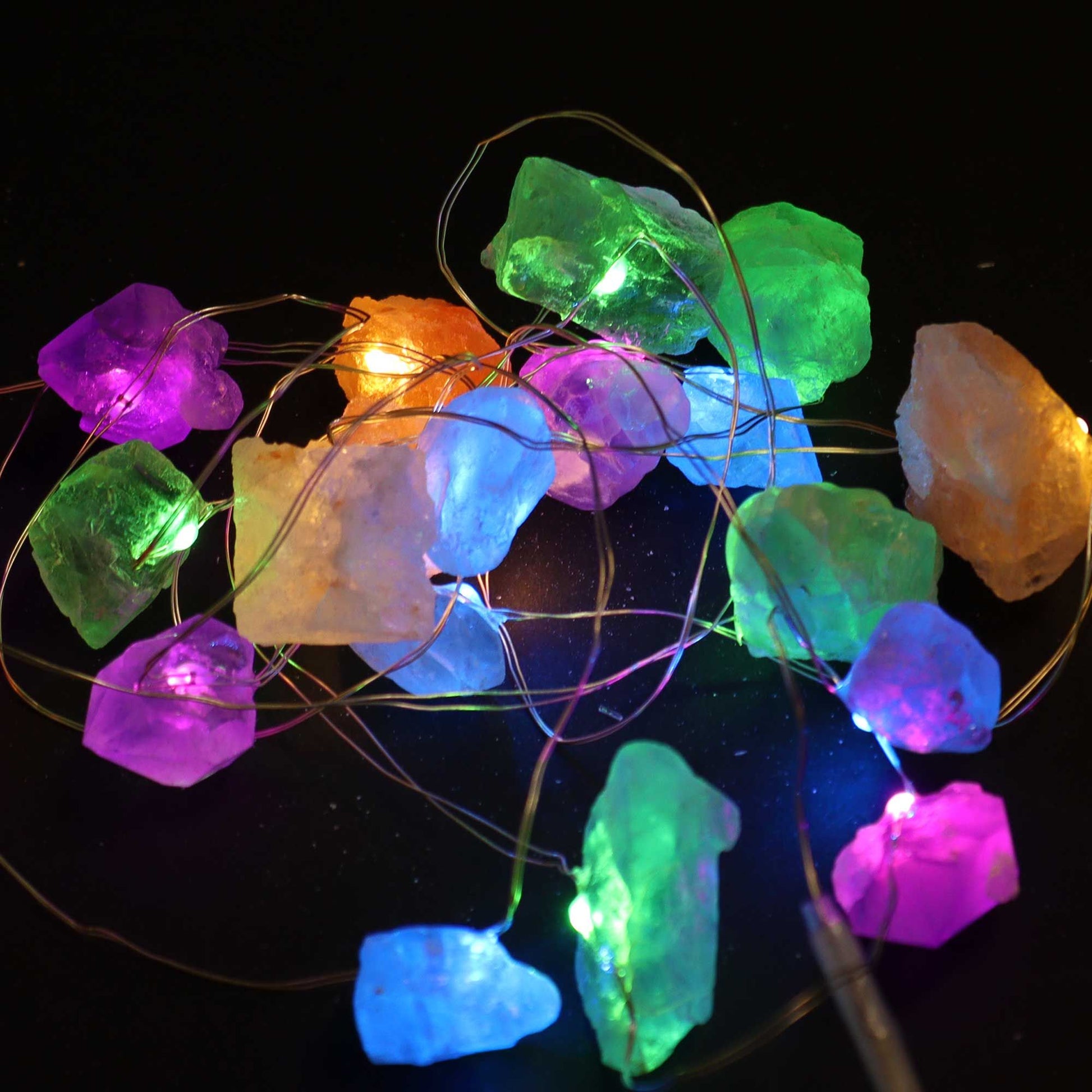 Beautifully arranged Gemstone Enchantment Lights showcasing 20 vibrant crystal rocks, perfect for creating a cosy ambience. Ideal as a Christmas gift for enhancing home décor and adding a magical touch. {{scent}} {{product_type}} – Christmas Gift Home Fragrance.