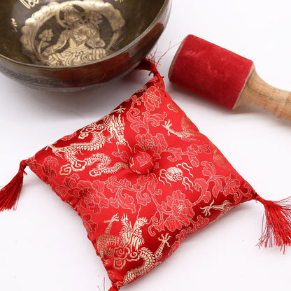 The Brass Golden Tara Singing Bowl Gift Set - Tibetan Serenity with an emphasis on the intricate red cushion and suede stick, enhancing meditation experiences. A great {{scent}} {{product_type}} – Christmas Gift Home Fragrance for a calm and serene environment.