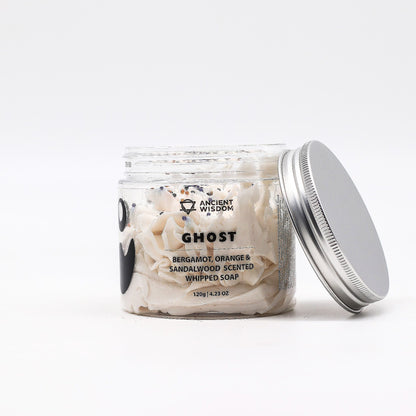 Close-up of Ghost Whipped Soap 120g in a clear jar, showcasing its creamy consistency and festive scent of bergamot, orange, and sandalwood – an ideal Christmas Gift Home Fragrance.