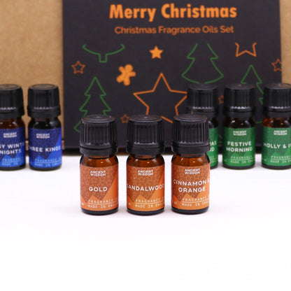 Elegant arrangement of Holy Scents Christmas Fragrance Oils, capturing the essence of winter nights and cheerful aromas.