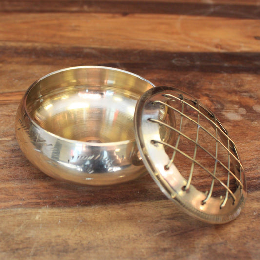 Elegant Brass Charcoal Incense Jar with a removable grid lid, ideal for burning resins and herbs. Perfect for enhancing your home fragrance this Christmas, making it a thoughtful gift. {{scent}} {{product_type}} â€“ Christmas Gift Home Fragrance.