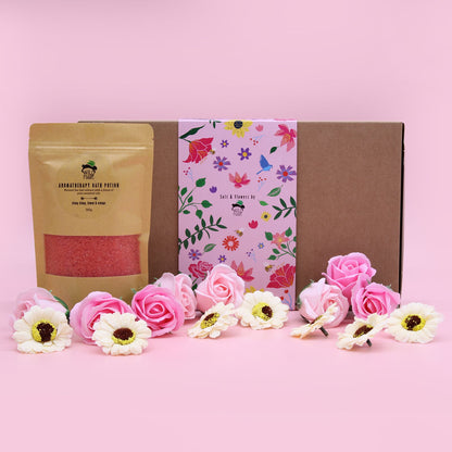 Attractive display of Ylang Ylang & Citrus Bath Salt Set alongside floral soap roses in a cheerful pink setting, perfect for gifting or self-pampering – Christmas Gift Home Fragrance