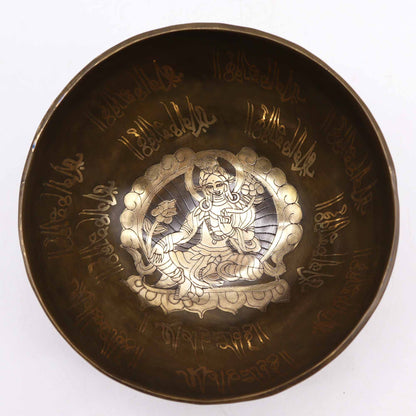 Top view of the Brass Golden Tara Singing Bowl Gift Set - Tibetan Serenity, showcasing detailed inscriptions and a serene image inside, perfect for creating soothing sounds. This {{scent}} {{product_type}} – Christmas Gift Home Fragrance promotes relaxation and mindfulness.
