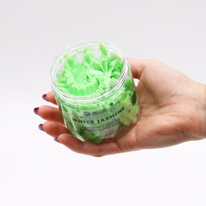 A hand holding the Gooseberry & White Tea Whipped Soap 120g – Vegan Luxury Care, showcasing its creamy texture. A lovely {{scent}} {{product_type}} – Christmas Gift Home Fragrance for skincare enthusiasts.