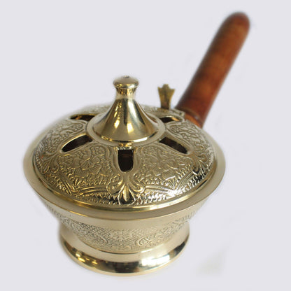 Close-up of the Intricate Brass Censer Incense Burner With Wooden Handle, showcasing its unique design and vented lid for optimal scent diffusion. A wonderful Christmas gift that brings warmth to your home fragrance experience.