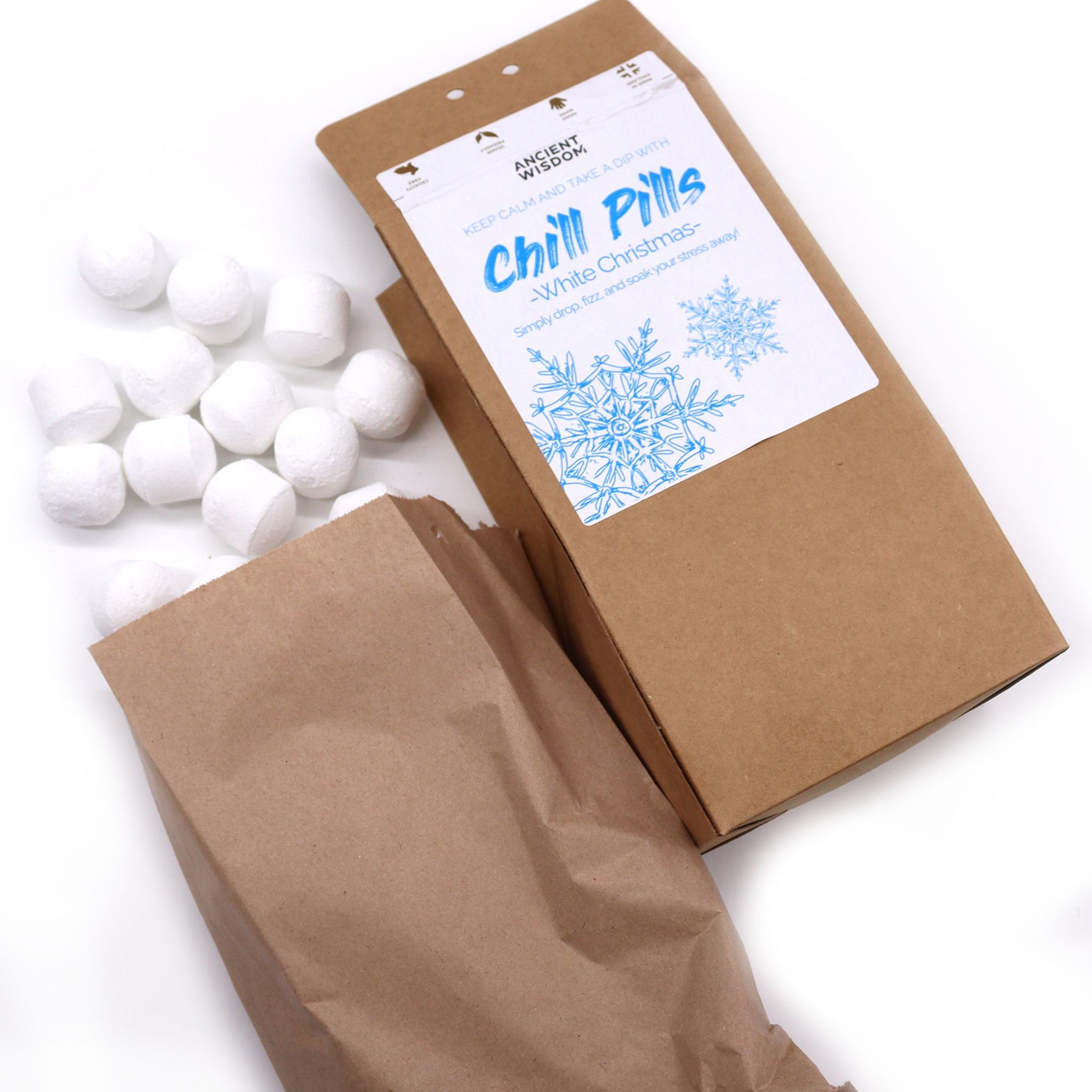 White Christmas Chill Pills Gift Pack 350g featuring festive bath bombs in a charming brown package, ideal for creating a cozy home spa experience this Christmas. Relax with enchanting scents of eucalyptus and mint orange. Perfect Christmas Gift Home Fragrance.