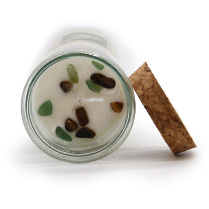 Top view of the Prosperity Magic Candle revealing Tiger Eye and Green Aventurine gemstones, with Lemon Honeysuckle scent, perfect for a Christmas gift home fragrance.