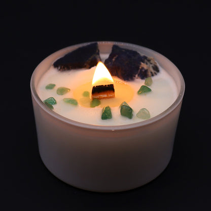Throat Chakra Candle with Sodalite & Jade lit, emphasizing its calming glow. An ideal {{scent}} {{product_type}} for enhancing home relaxation and perfect for Christmas gifting.