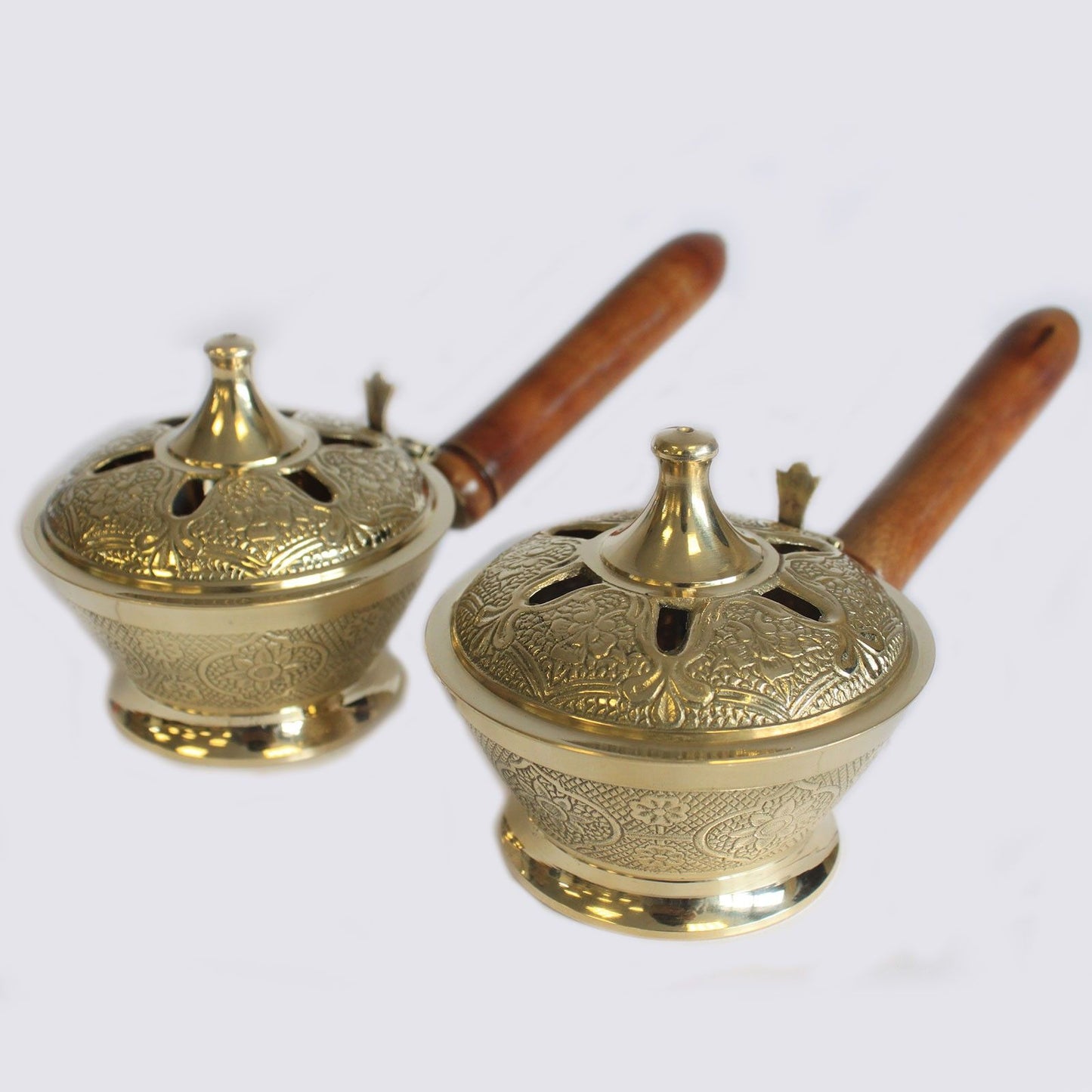 Two Intricate Brass Censer Incense Burners With Wooden Handles displayed together, celebrating their beautiful details and versatility in enhancing home fragrance. An ideal Christmas gift for any fragrance enthusiast.