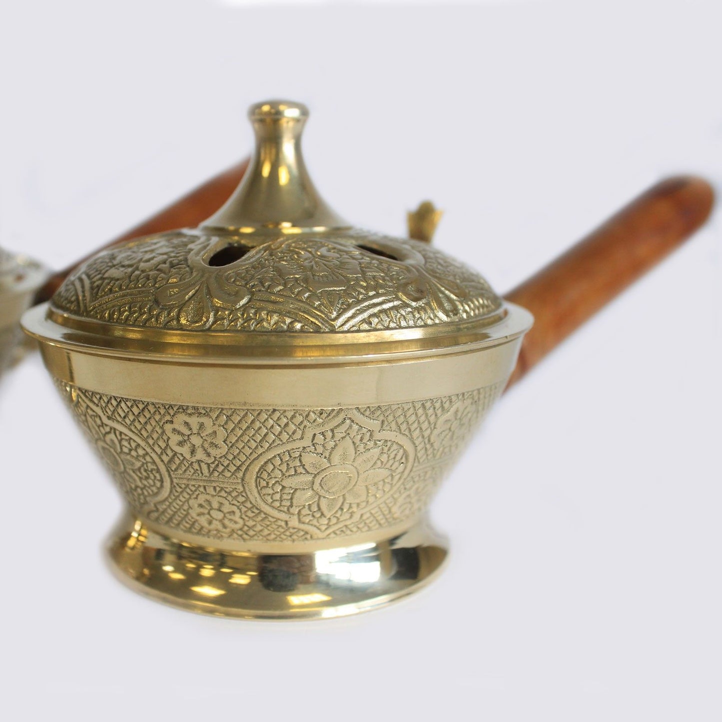 Side view of the Intricate Brass Censer Incense Burner With Wooden Handle, emphasising its antique style and craftsmanship. Perfect for creating warm aromas as a thoughtful Christmas gift for home fragrance lovers.