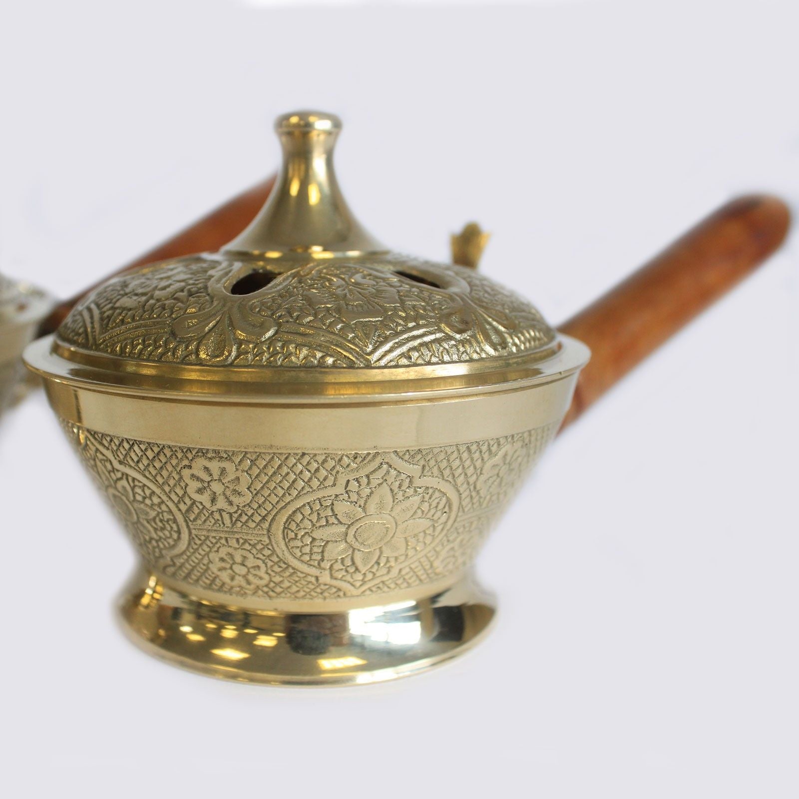 Side view of the Intricate Brass Censer Incense Burner With Wooden Handle, emphasising its antique style and craftsmanship. Perfect for creating warm aromas as a thoughtful Christmas gift for home fragrance lovers.