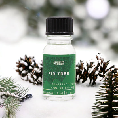 Fir Tree Fragrance Oil 10ml displayed with pine cones in a snowy setting, a delightful choice for home fragrance enthusiasts. This festive fragrance makes a wonderful Christmas gift or stocking filler, embodying the spirit of winter spice and aromatherapy.