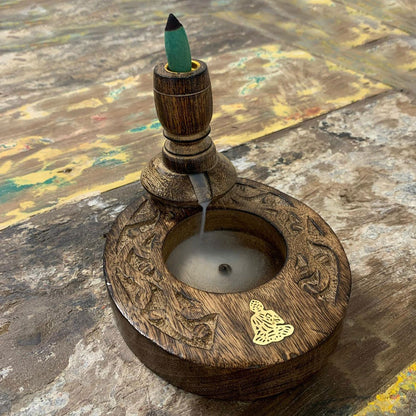 Sm Mango Wood Backflow Burner - Brass Buddha in action with smoke flowing gracefully, demonstrating its unique cascading smoke effect for a tranquil atmosphere. Perfect for Christmas Gift Home Fragrance.