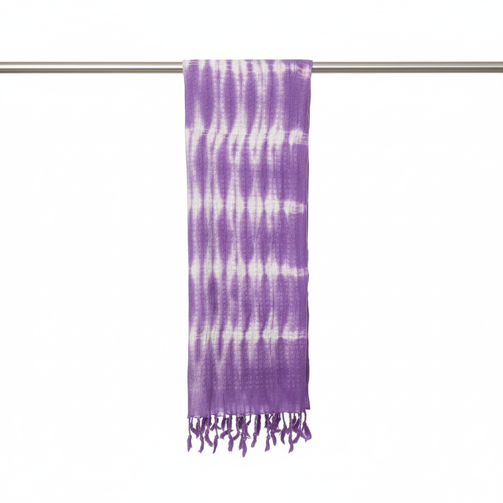 Purple and white tie-dye scarf on a silver rod against a white background