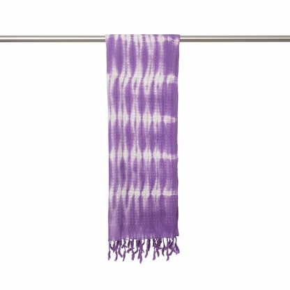 Purple and white tie-dye scarf on a silver rod against a white background