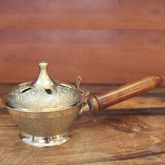 Intricate Brass Censer Incense Burner With Wooden Handle showcasing ornate floral motifs, perfect for adding a touch of elegance to your space. Ideal for creating beautiful home fragrances this Christmas gift.