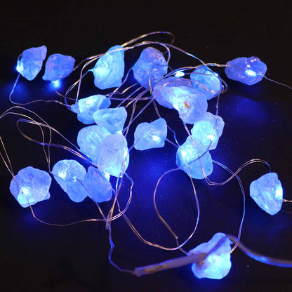 A vibrant display of Celestite Gemstone Enchantment LED Lights glowing a calming blue, perfect for adding charm to your home decor. {{scent}} {{product_type}} – Christmas Gift Home Fragrance.