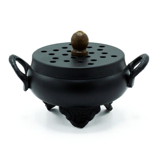 Mystical Cast Iron Cauldron Incense Burner displayed elegantly, showcasing its unique design and craftsmanship, perfect for creating a magical ambience. Ideal as a Christmas Gift Home Fragrance, this scent product type blends functionality with charm.
