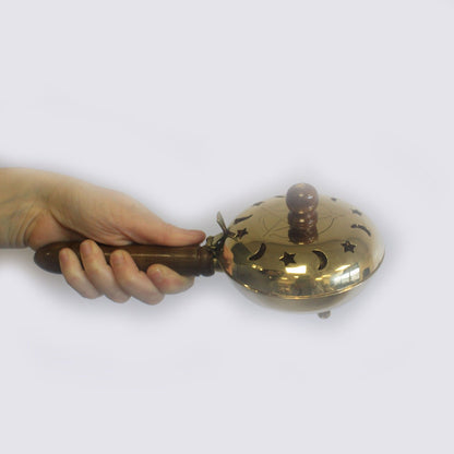 Brass Pentagram Incense Butler with Wooden Handle showcased in a hand, perfect for enhancing your sacred space. This unique {{scent}} {{product_type}} is an ideal Christmas Gift for those who appreciate home fragrance.