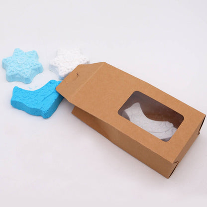 Close-up view of the Break the Ice Christmas Bath Bomb Gift Pack, featuring blue and white intricate bath bomb shapes. Ideal for a joyful Christmas gift to elevate your home fragrance experience.