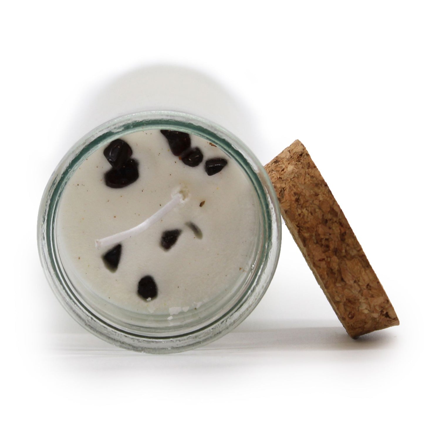 A top view of the Blood Garnet & Lily Soy Wax Candle in a glass jar with a cork lid, featuring embedded Blood Garnet gemstones. This delightful {{scent}} {{product_type}} makes for a perfect Christmas Gift Home Fragrance.