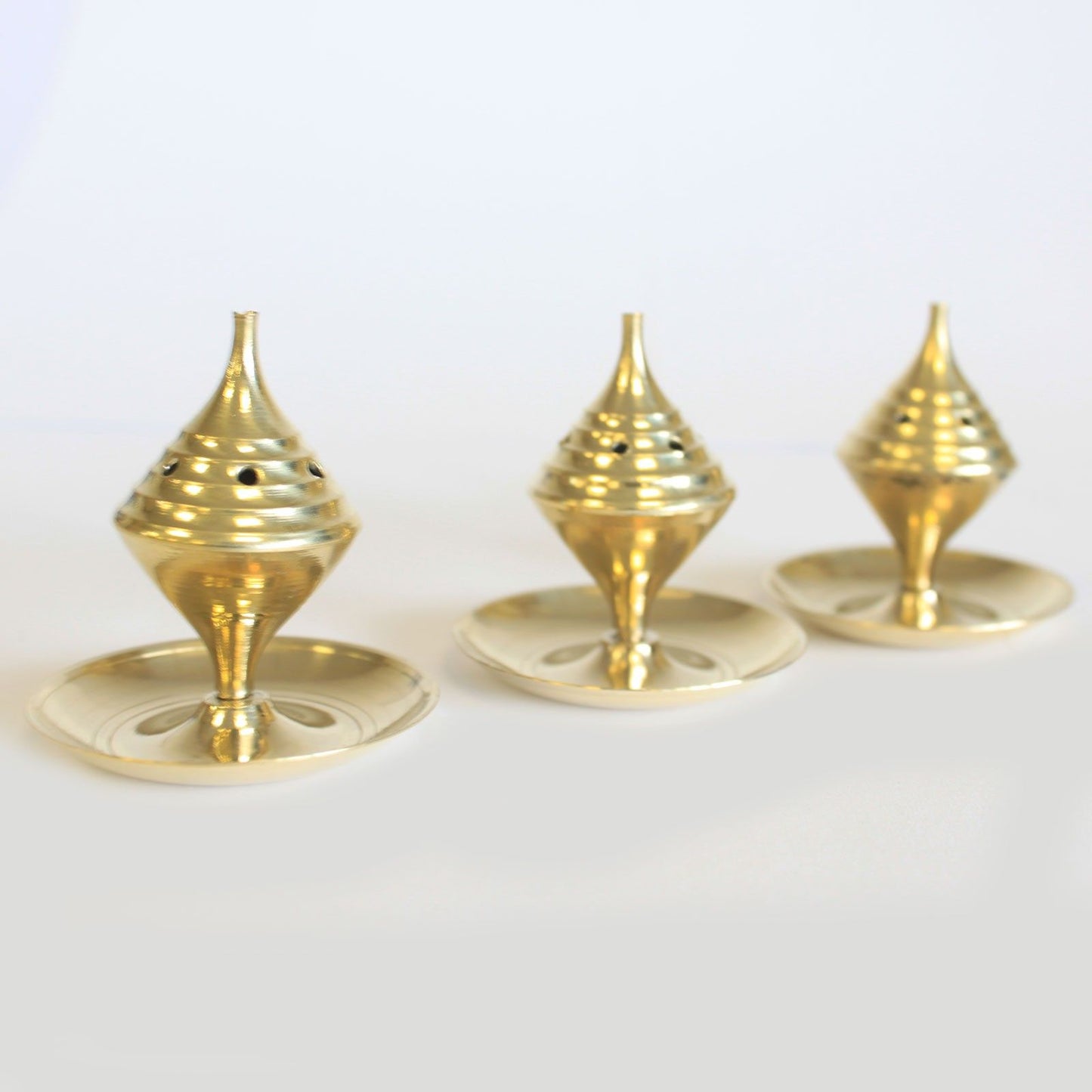 Small Brass Incense Burner - Elegant Design for Meditation showcasing three charming burners. These brass incense burners are perfect for enhancing home fragrance, making an ideal Christmas gift for anyone who loves soothing aromas in their living space.