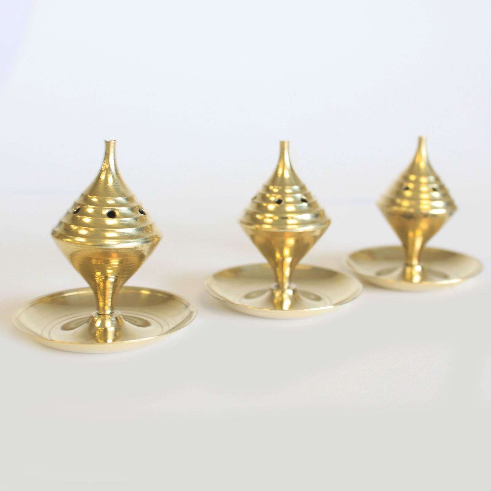 Small Brass Incense Burner - Elegant Design for Meditation showcasing three charming burners. These brass incense burners are perfect for enhancing home fragrance, making an ideal Christmas gift for anyone who loves soothing aromas in their living space.