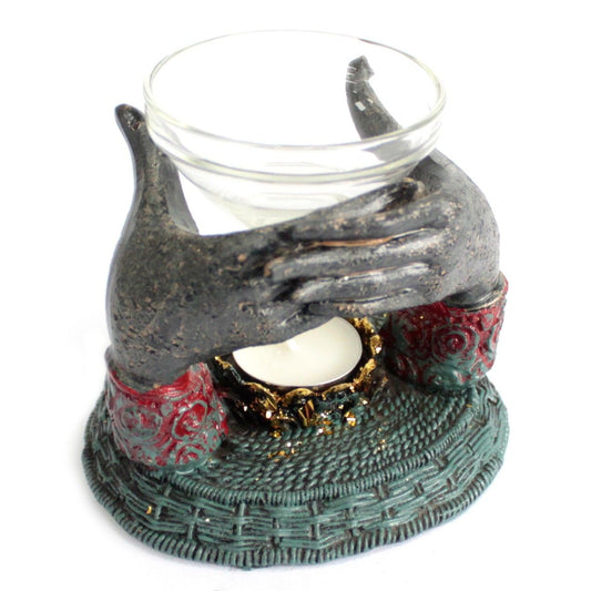 Antique Buddha Oil Burner showcasing exquisite craftsmanship with hands holding a glass dish. Perfect for creating serene scents in your home, this unique scent oil burner enhances your relaxation space. Ideal as a Christmas gift for a delightful home fragrance.