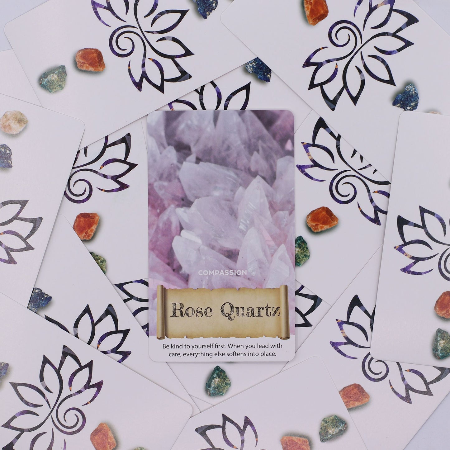 Rose Quartz card from the Crystals & Elixirs Oracle Cards deck, surrounded by crystals and floral patterns, emphasising compassion and self-love. A lovely {{scent}} {{product_type}} – Christmas Gift Home Fragrance.