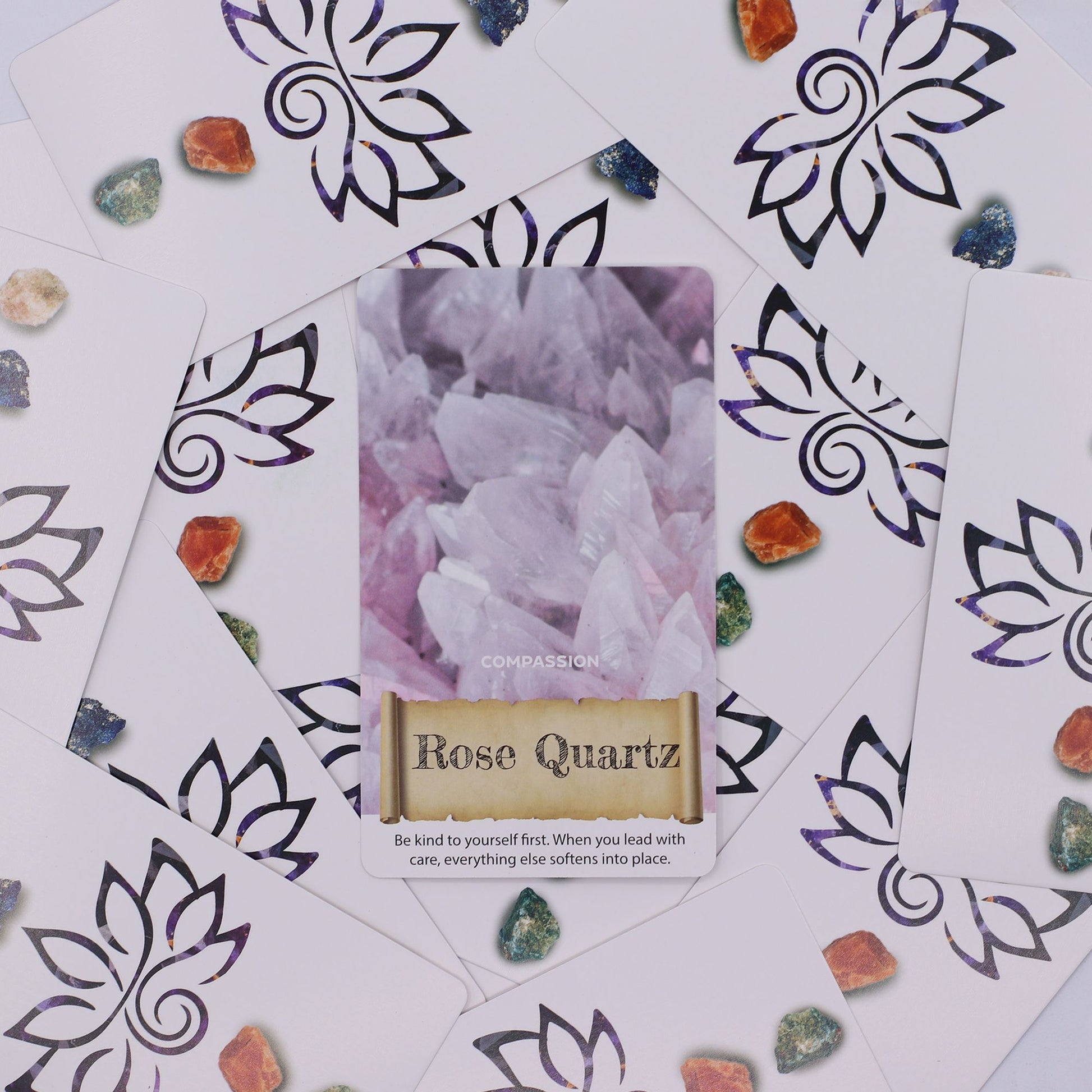Rose Quartz card from the Crystals & Elixirs Oracle Cards deck, surrounded by crystals and floral patterns, emphasising compassion and self-love. A lovely {{scent}} {{product_type}} – Christmas Gift Home Fragrance.