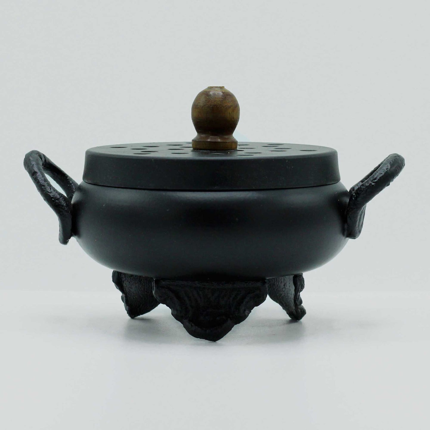 Mystical Cast Iron Cauldron Incense Burner with a smooth, rounded design and striking handles, perfect for enhancing your home décor. Ideal for creating a magical atmosphere, this unique product serves as an excellent Christmas gift for anyone fond of home fragrance.