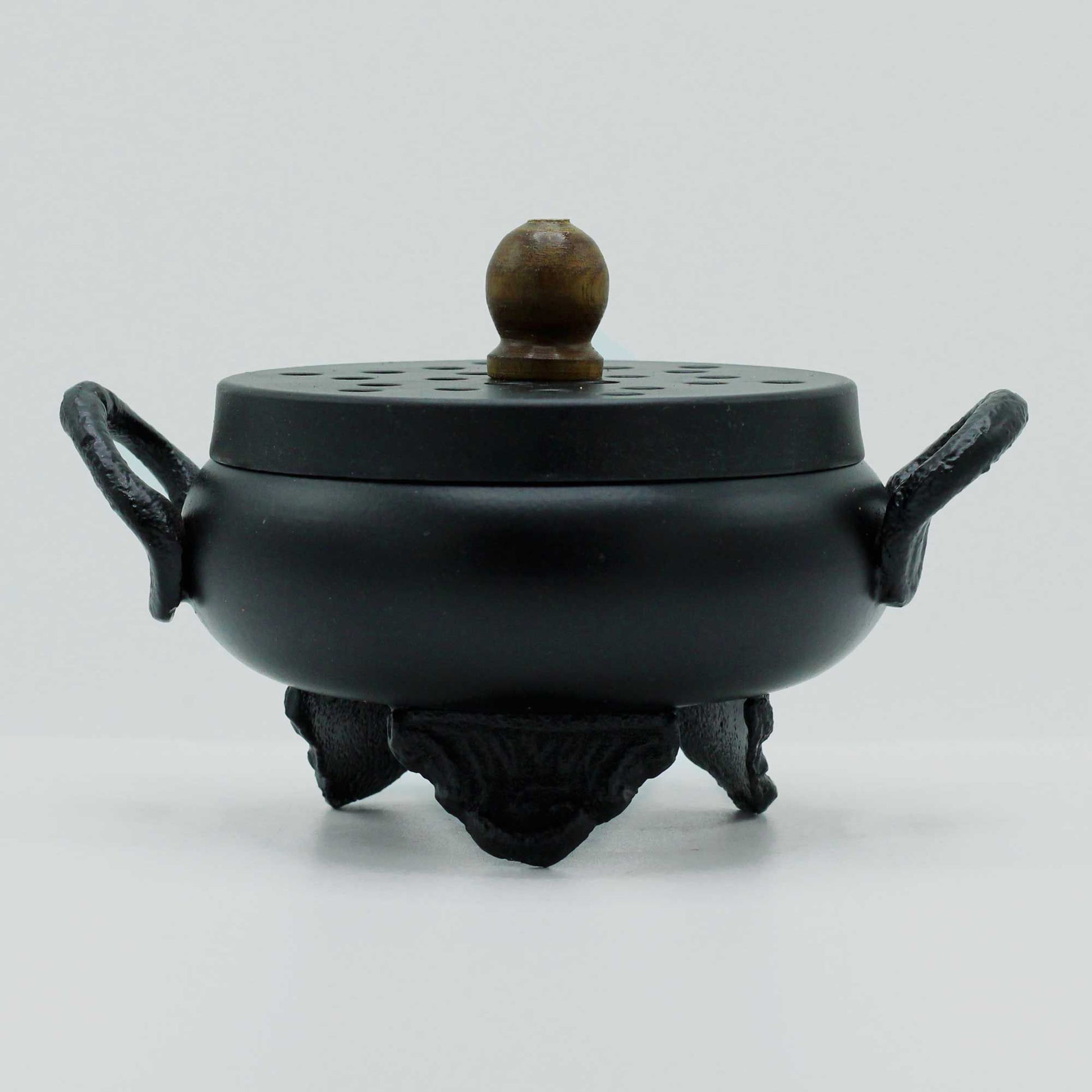 Mystical Cast Iron Cauldron Incense Burner with a smooth, rounded design and striking handles, perfect for enhancing your home décor. Ideal for creating a magical atmosphere, this unique product serves as an excellent Christmas gift for anyone fond of home fragrance.
