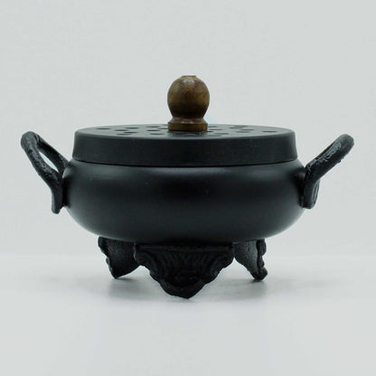 Mystical Cast Iron Cauldron Incense Burner with a smooth, rounded design and striking handles, perfect for enhancing your home décor. Ideal for creating a magical atmosphere, this unique product serves as an excellent Christmas gift for anyone fond of home fragrance.