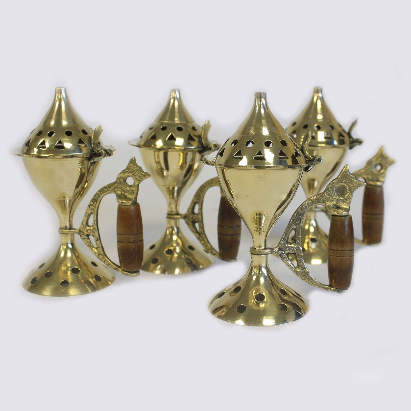 Elegant Brass Cone Incense Burner with Carved Handle – a set of five intricately designed incense burners, showcasing polished brass and detailed vented lids, great for enhancing your home’s scent. Perfect as a Christmas gift for creating a serene atmosphere.